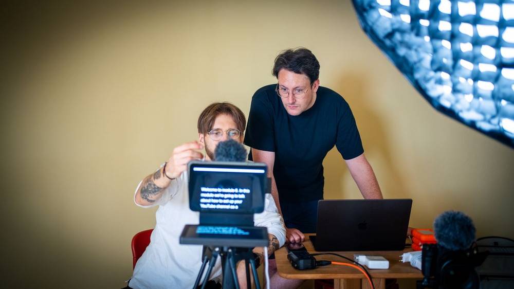 Reviewing a submission together on the studio monitor